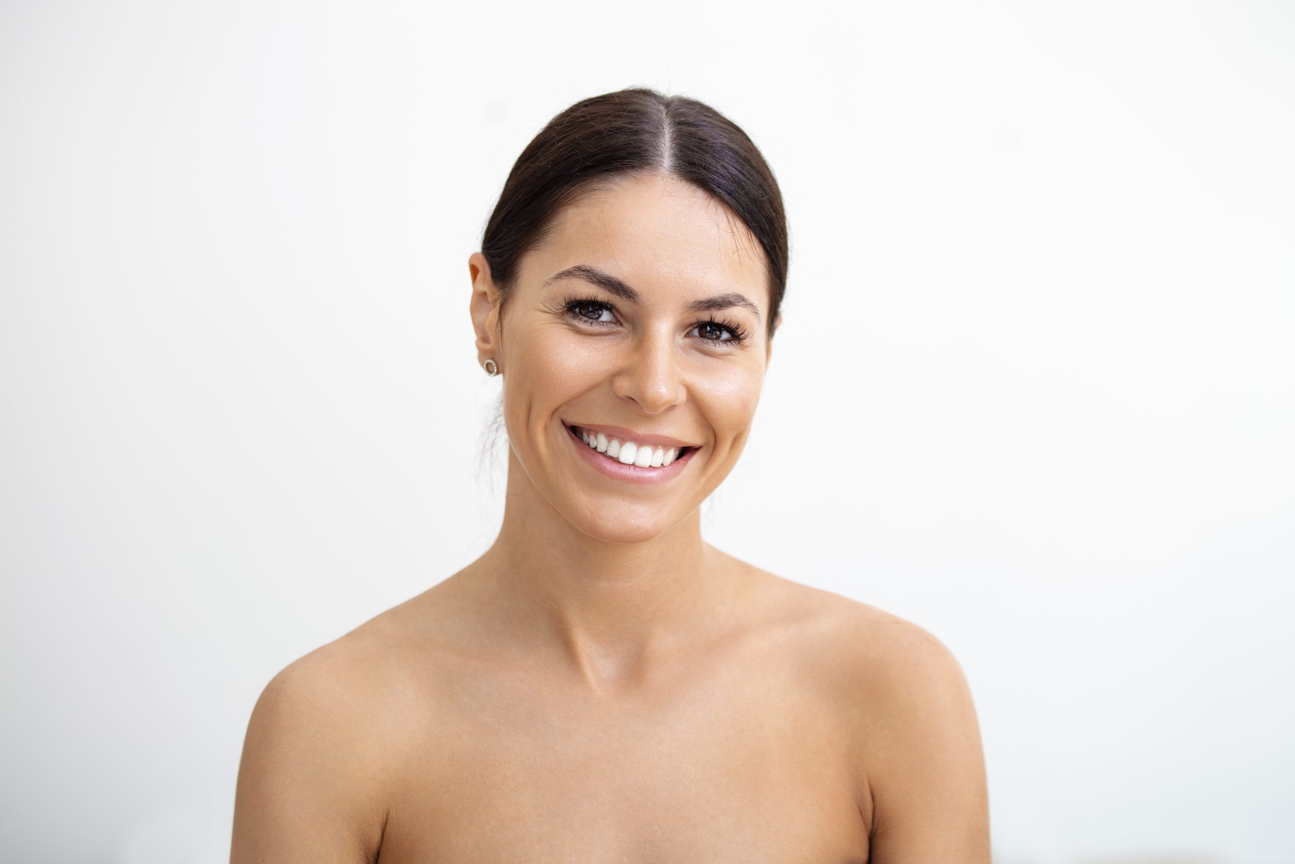 young pretty woman getting special skin treatment beautiful girl applying serum isolated white background smooth skin without wrinkles